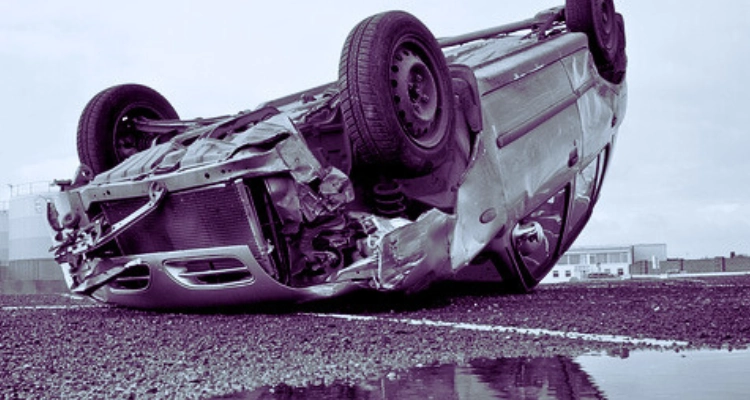 Rollover car in the middle of the road.